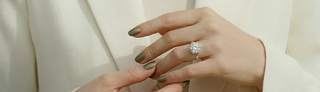 Lab grown diamond six-prong solitaire engagement ring on woman's hand