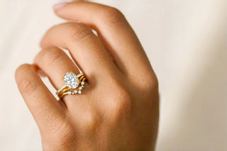 Curved wedding band stack with engagement ring