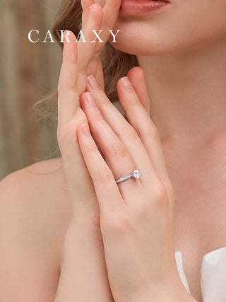 Lifestyle view of a model wearing a 1 carat engagement ring with pavé accents.