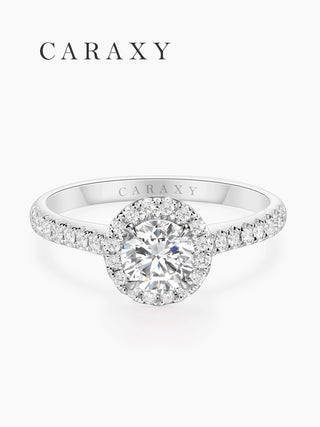 Top view of a 1.5-carat round diamond halo ring with shimmering pavé accents.
