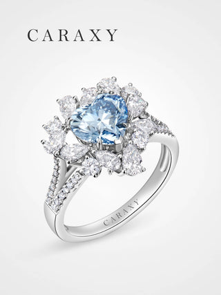 Perspective view of the Caraxy blue diamond ring showcasing the split-shank pavé band.