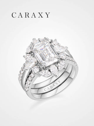 Perspective view of the emerald cut bridal set showing the 3 carat center stone and the tiered diamond cluster.