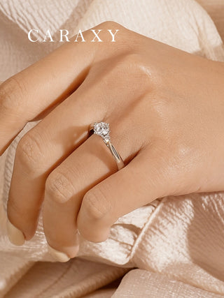 Model wearing the 1 carat diamond ring on her finger, showing a side perspective of the three stone design.