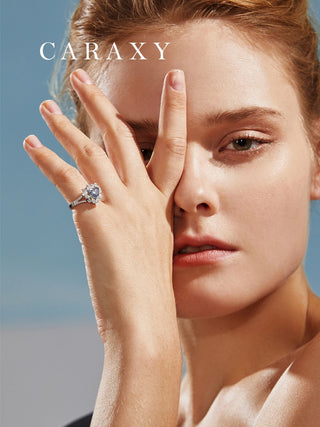 Lifestyle image of a model showcasing the vintage style blue diamond heart ring against a soft background.