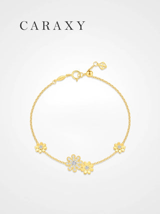 CARAXY 18K yellow gold daisy bracelet with multiple lab diamond flower charms on a clean white background.