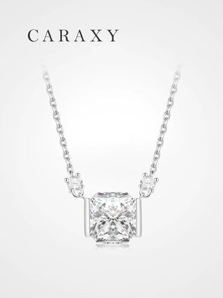 Front view of 1 carat radiant cut diamond pendant in 18K white gold bar setting.