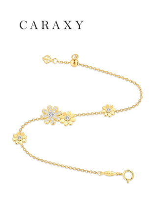 S-curve display of the yellow gold daisy charm bracelet showing the adjustable clasp and hallmark.