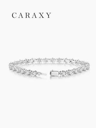 CARAXY platinum diamond tennis bracelet with lucky clover-shaped links and a secure box clasp.