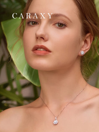 Model wearing the matching snowflake diamond necklace and earrings set for a coordinated bridal look.