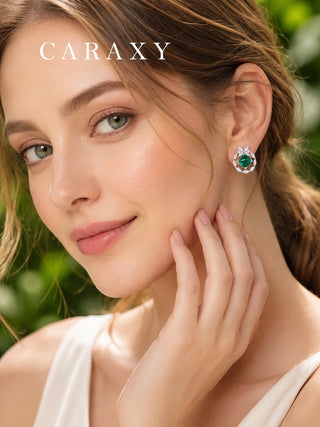 Woman wearing CARAXY emerald and diamond butterfly stud earring from the Spirit Collection