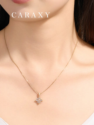 Model wearing the minimalist jewelry piece, showing the clover pendant's elegant scale on the neckline.