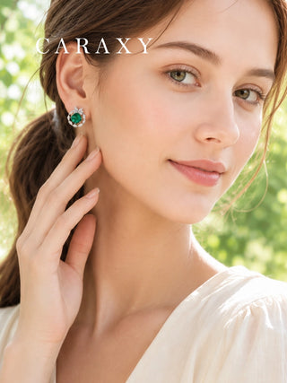 Emerald butterfly stud earring in 18K white gold styled on ear
