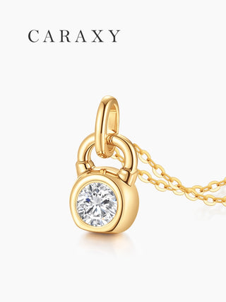 Close-up of a bezel set lab grown diamond kettlebell pendant in yellow gold.