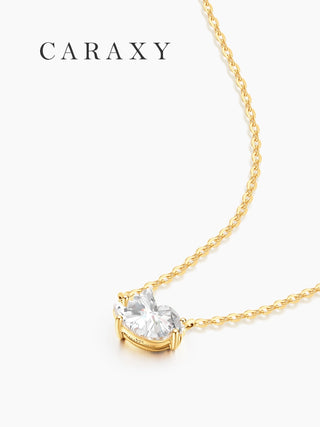 Side view of bird-inspired diamond pendant necklace showing open gallery setting and 18K yellow gold chain.