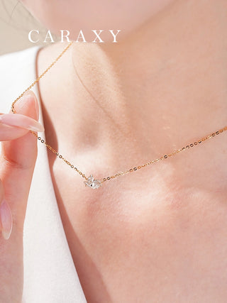 Close-up of bird-inspired lab grown diamond necklace with feather-like diamond facets.
