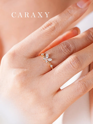Close-up of a butterfly lab-grown diamond ring worn on the hand