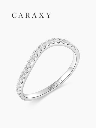 Side profile of an 18K white gold diamond wave band with tiger-claw prongs