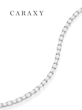 Close-up of alternating emerald-cut and round lab-grown diamonds in a white gold tennis bracelet