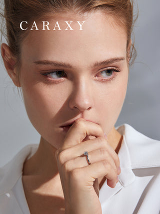 Lifestyle view of a model wearing the CARAXY floral-inspired solitaire diamond ring.