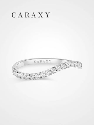 Front view of a half-eternity diamond wave wedding band in white gold