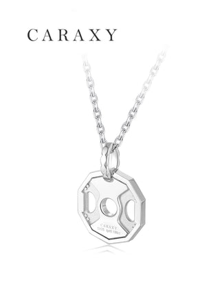 Close-up of a diamond weight plate pendant engraved with Stay Toned and Live Fit