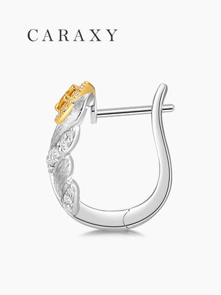 Side view of a sterling silver feather earring with a hinged leverback closure