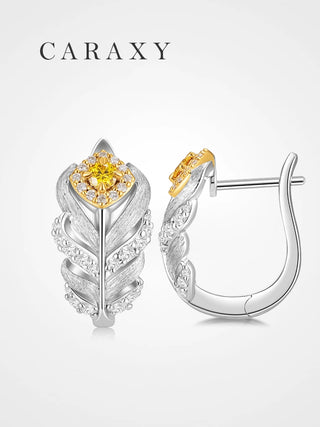 Front and side views of fancy yellow lab-grown diamond feather earrings in sterling silver