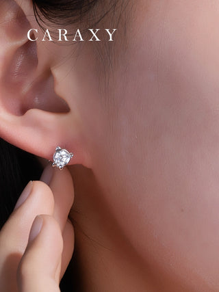 Model wearing cat diamond stud earrings in a close-up ear view.