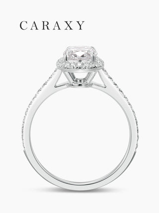 Side view showcasing the cathedral setting and pavé halo of this oval diamond ring.