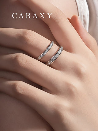 Woman wearing two lab grown diamond channel-set wedding bands in platinum silver