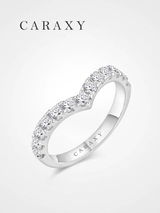 Angled view of a chevron curved diamond band with round diamonds across the top half