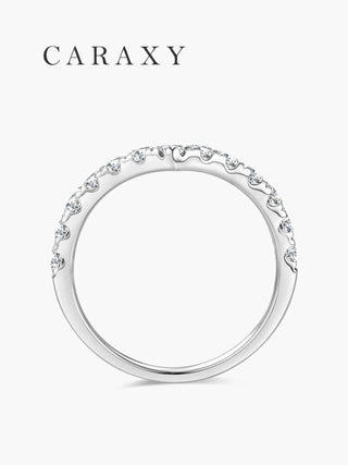 Side profile of a chevron half eternity diamond wedding band with round diamonds