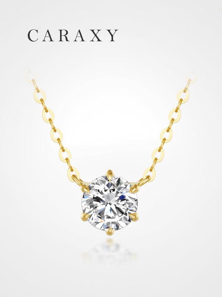 Classic solitaire diamond necklace in 18K yellow gold featuring a round lab grown diamond and six-prong setting.