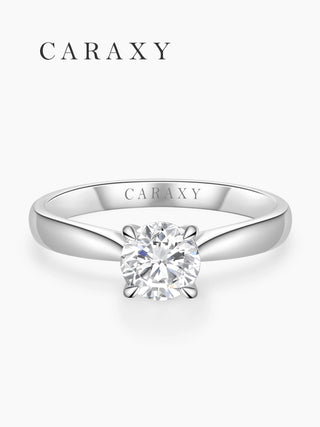 Top view of a round brilliant diamond solitaire ring with a four-prong setting.