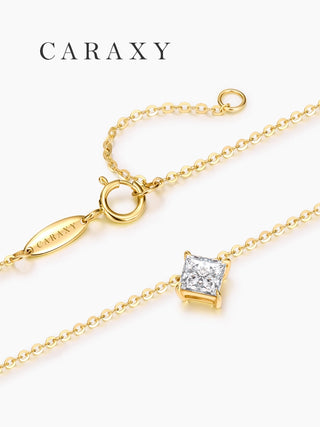 close-up of princess cut diamond pendant with minimalist gold chain