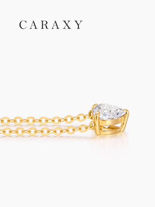 close-up side view of heart diamond pendant with 18k gold chain