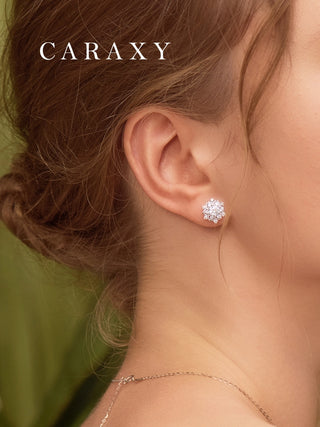 Cluster diamond earrings shown on model with elegant natural styling.