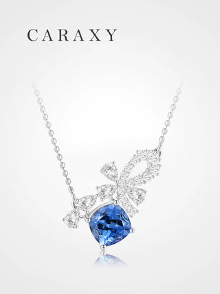 Cornflower blue lab-grown sapphire bow necklace with lab-grown diamond accents in 18K white gold, front view