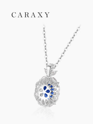 Back view of cornflower blue sapphire necklace showing the open-back gallery and leaf-inspired pendant design.