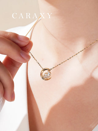 Model wearing a crescent moon diamond necklace in 18K yellow gold with adjustable chain.