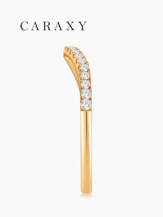 Side profile of a slim 18K yellow gold curved wedding band with half-set round lab-grown diamonds.