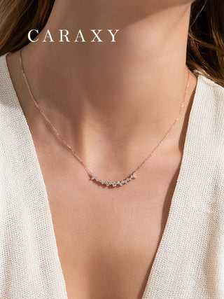 Front view of a curved lab grown diamond necklace in 18K rose gold featuring marquise and round diamonds in a nature-inspired design.