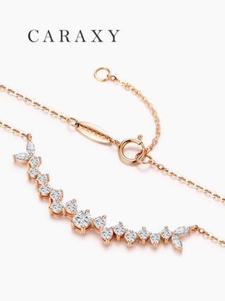 Close-up of a leaf-inspired curved diamond necklace in 18K rose gold with lab grown marquise and round brilliant diamonds, adjustable cable chain, and spring ring clasp.