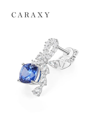 Angled view of a cushion cornflower blue sapphire earring in white gold.