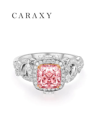 front view of cushion-cut pink diamond ring with intricate 18K gold floral band
