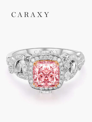 front view of cushion-cut pink diamond ring with intricate 18K gold floral band