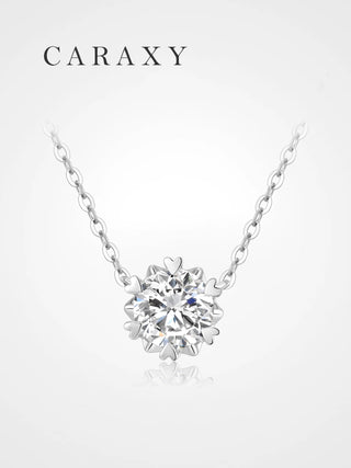 Dainty lab grown diamond solitaire necklace in 18K white gold with snowflake-inspired heart prong setting.