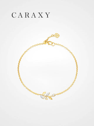 Dainty leaf bracelet in 18K yellow gold with marquise and round lab grown diamonds.