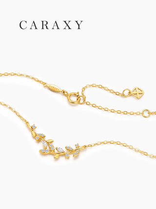 Dainty leaf vine diamond necklace in 18K yellow gold with adjustable cable chain and spring ring clasp.