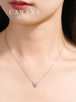 Model wearing the dainty nature-inspired jewelry piece, showing its elegant scale.